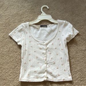 brandy Melville shirt with pink tulips on it and Little dots in the shirt